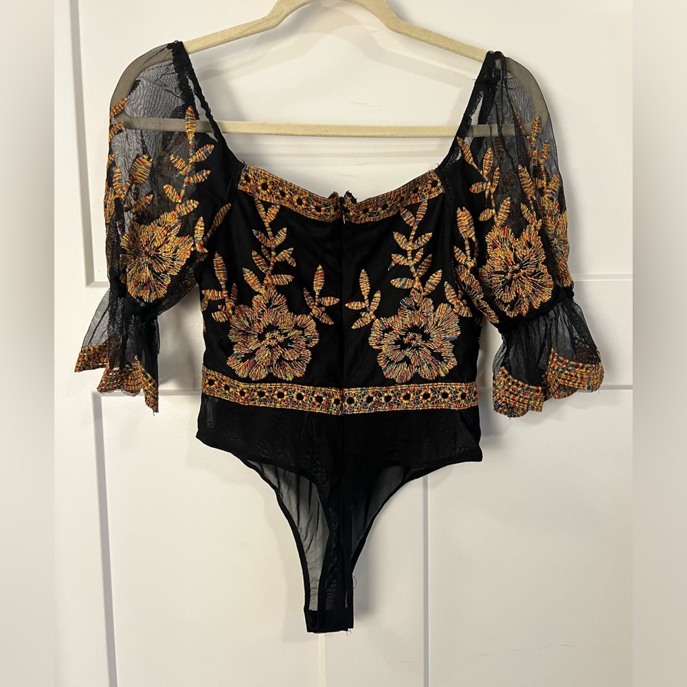 Sheer body suit. New without tags, never worn.